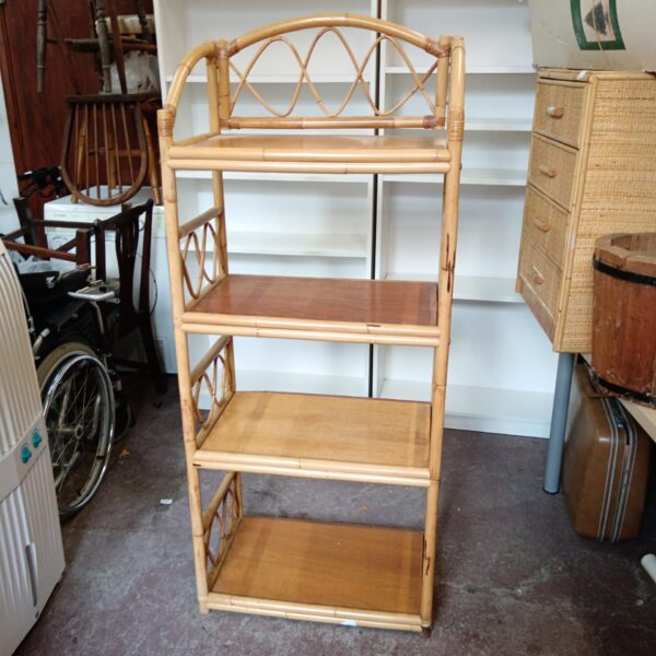 Vintage bamboo shelving unit with four tiers for display.