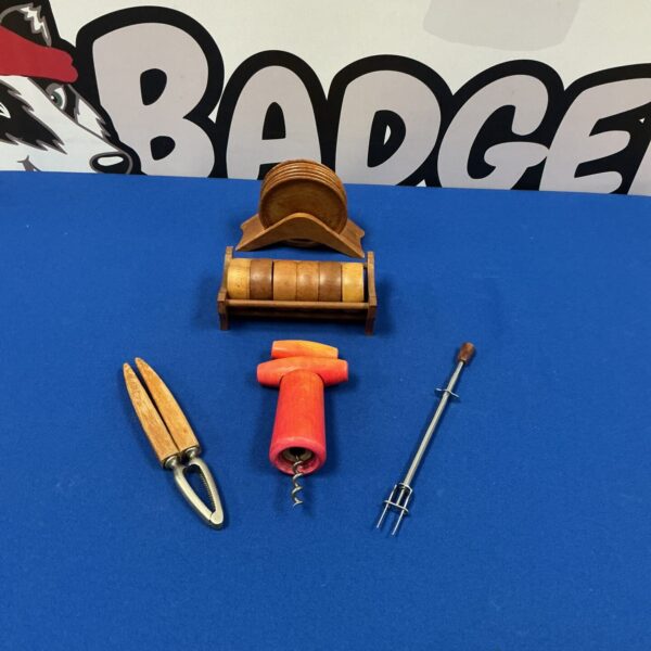 Vintage bar set with wooden stand and bar tools.