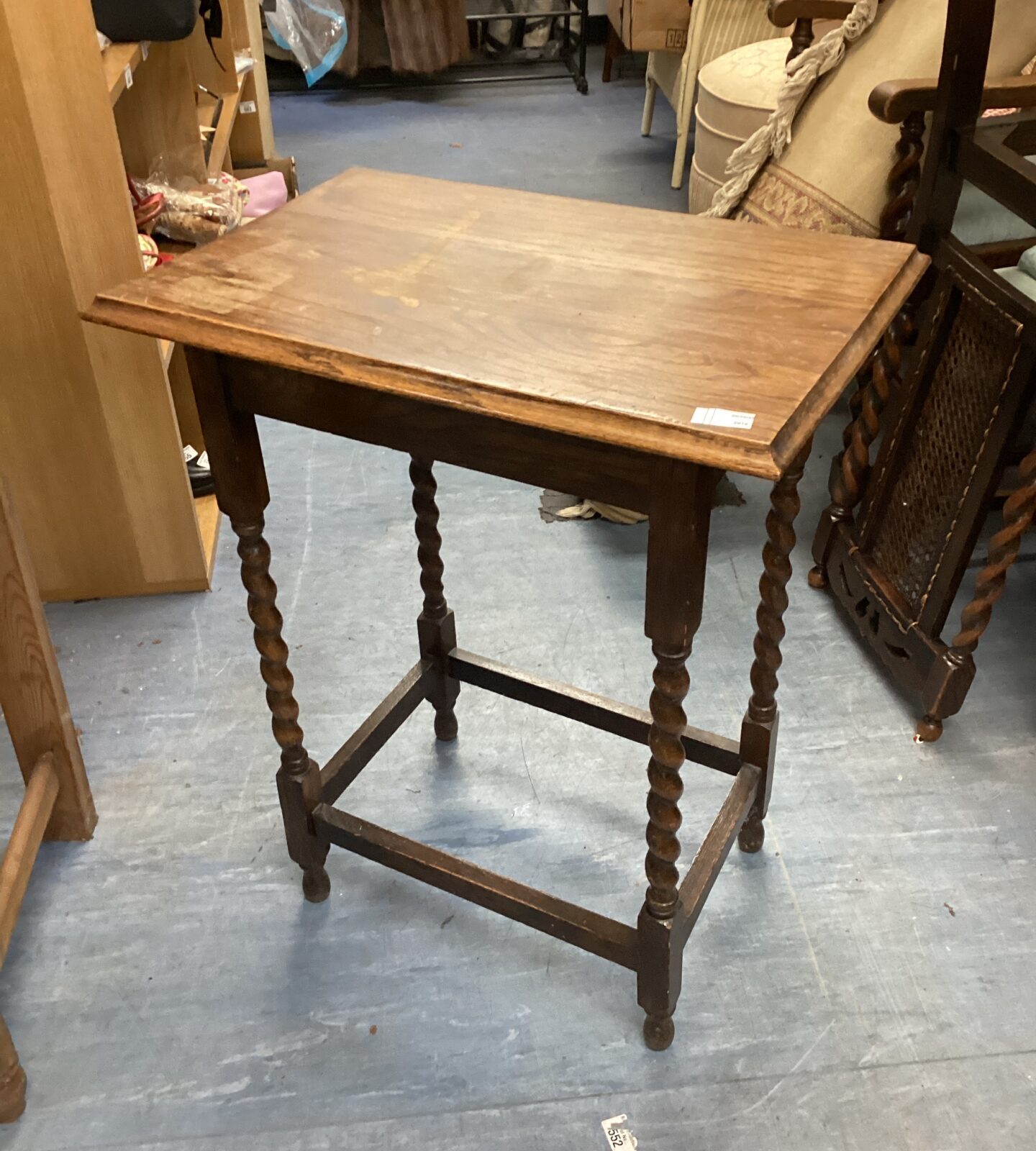 Vintage barley twist hall table with turned legs and wooden tabletop.