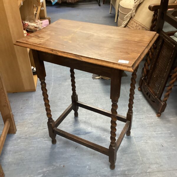 Vintage barley twist hall table with turned legs and wooden tabletop.