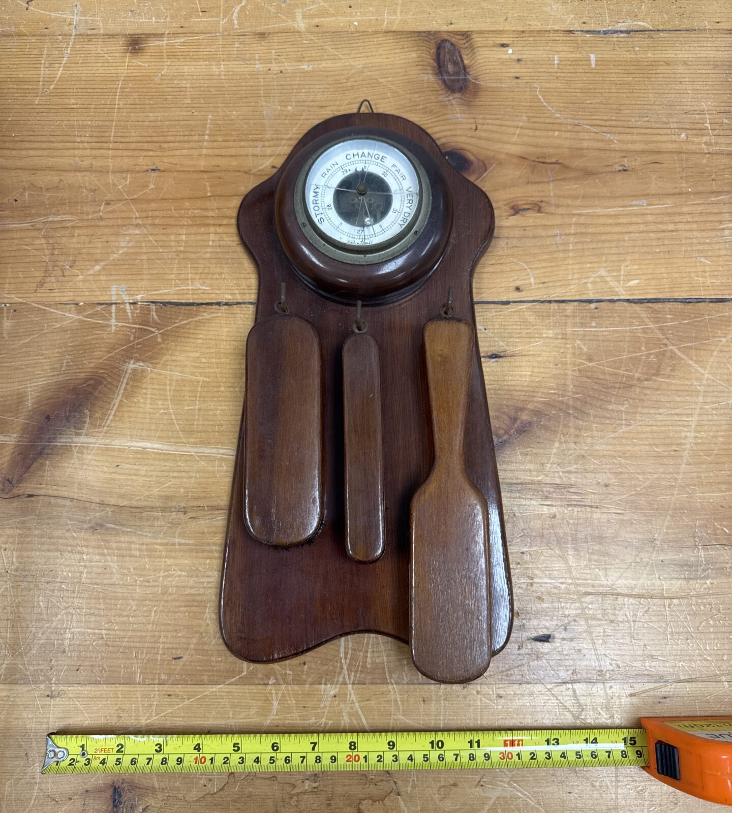 Vintage 1940s mahogany barometer and clothes brush wall hanging.