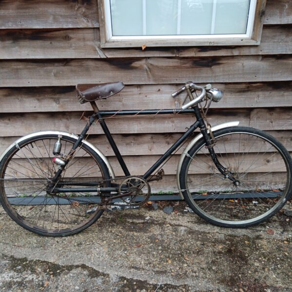 Vintage 1930s bicycle with rod brakes and dynamo.