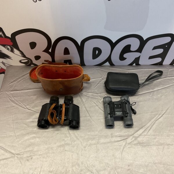 Vintage binoculars pair, including Praktica and Omega brands.