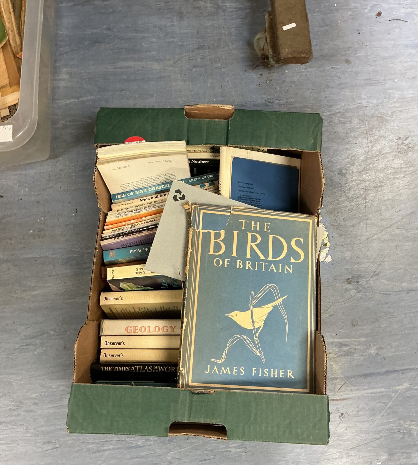 A stack of vintage books including Birds of Britain.