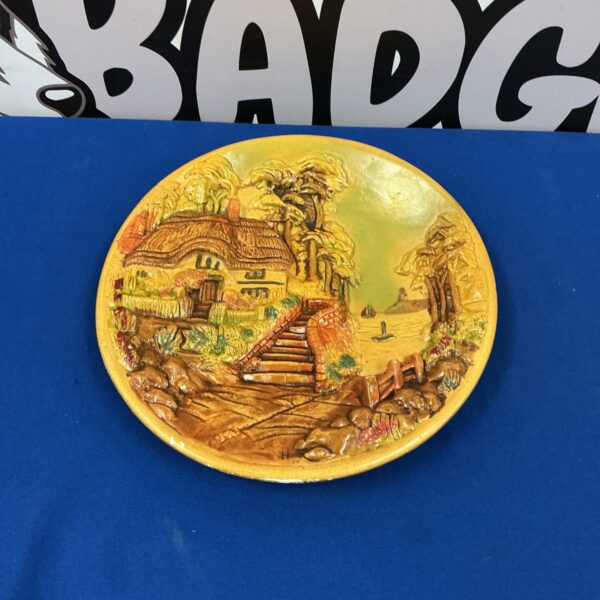 Vintage Boston chalkware wall hanging with a cottage landscape scene.