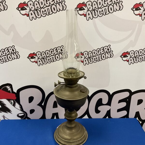 Vintage brass duplex paraffin lamp with intricate detailing.
