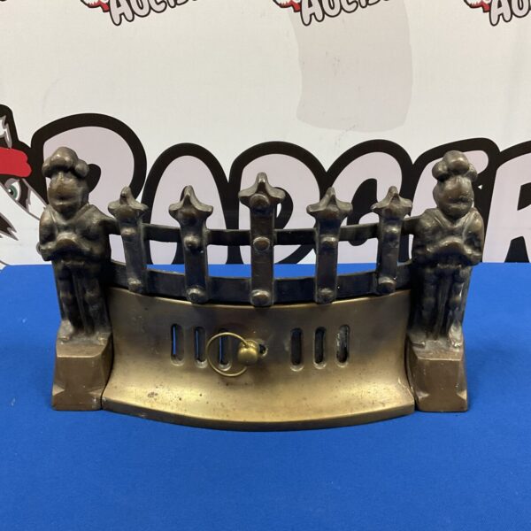 Vintage brass fireplace fender with knight design.