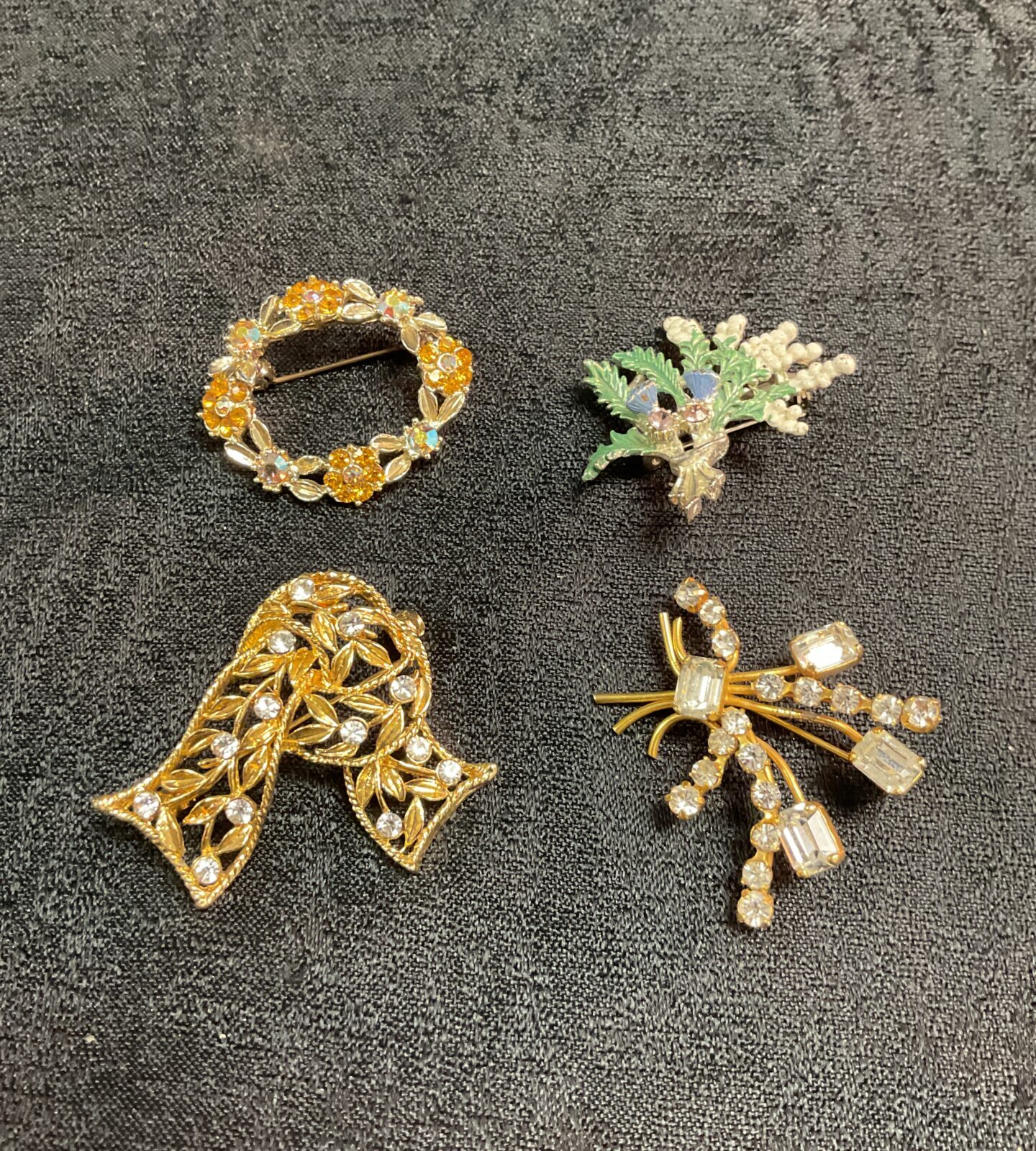 Close-up of a vintage floral brooch with sparkling accents.