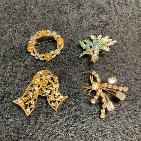 Close-up of a vintage floral brooch with sparkling accents.