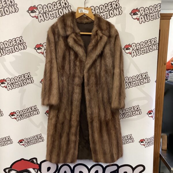 Vintage brown fur coat, a luxurious women's winter garment.