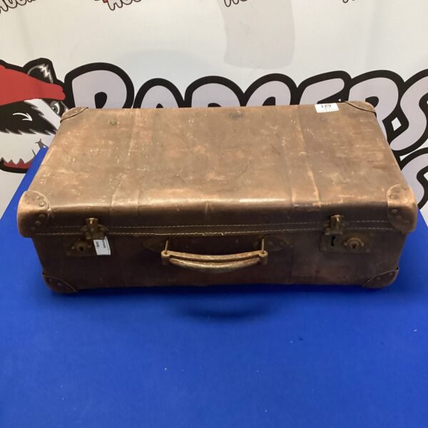 Vintage brown leather suitcase with a classic travel aesthetic.