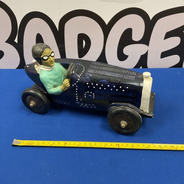 Vintage pottery Bugatti racing car ornament, classic design.