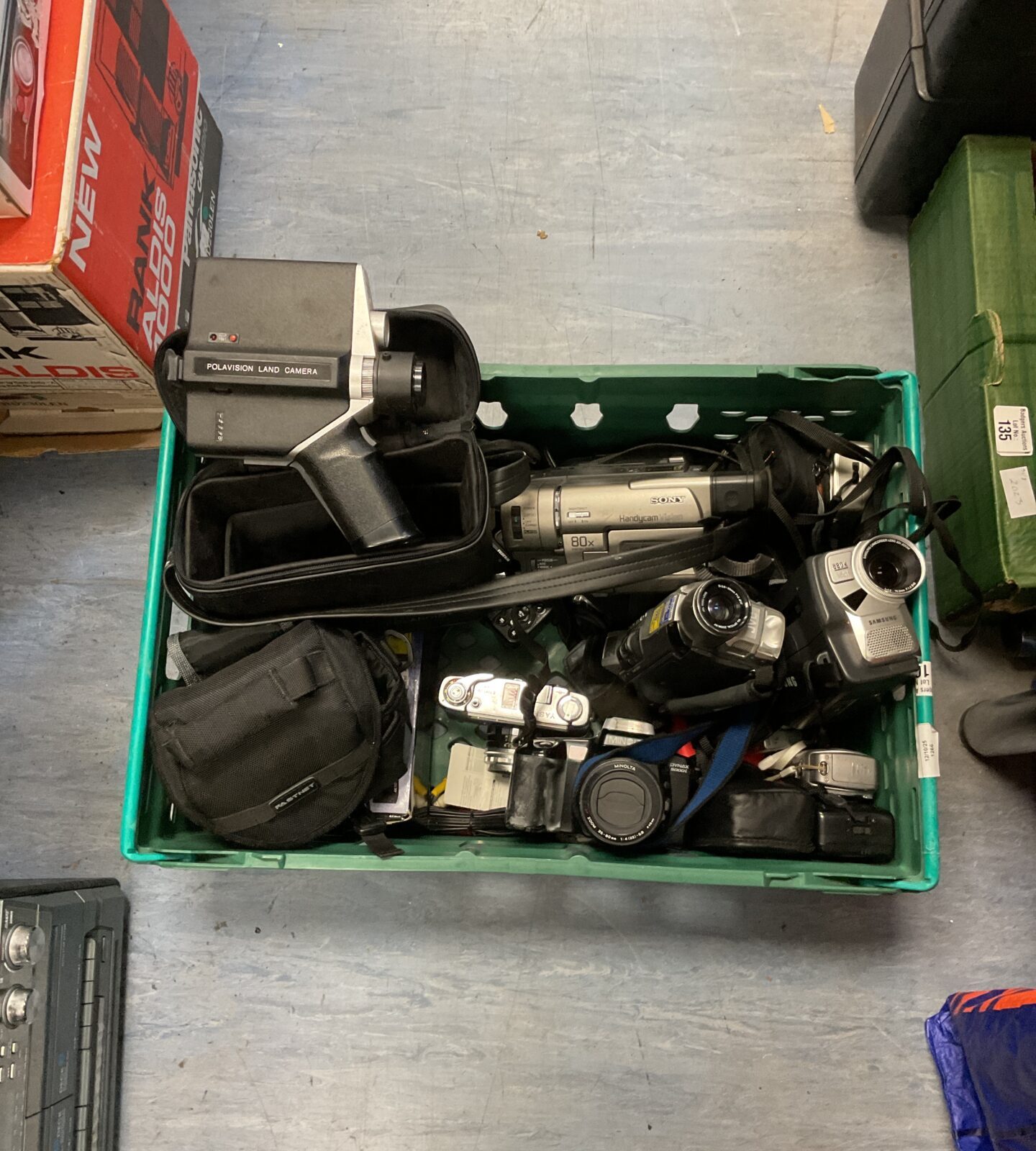 Mixed lot of vintage camcorders and cameras from various brands.