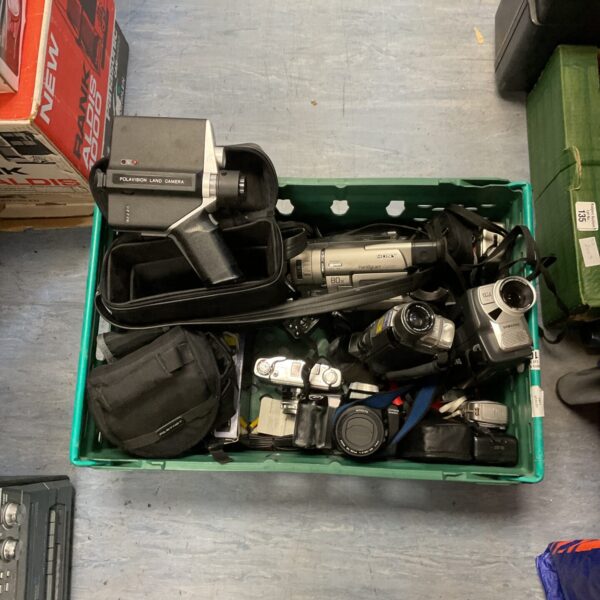 Mixed lot of vintage camcorders and cameras from various brands.
