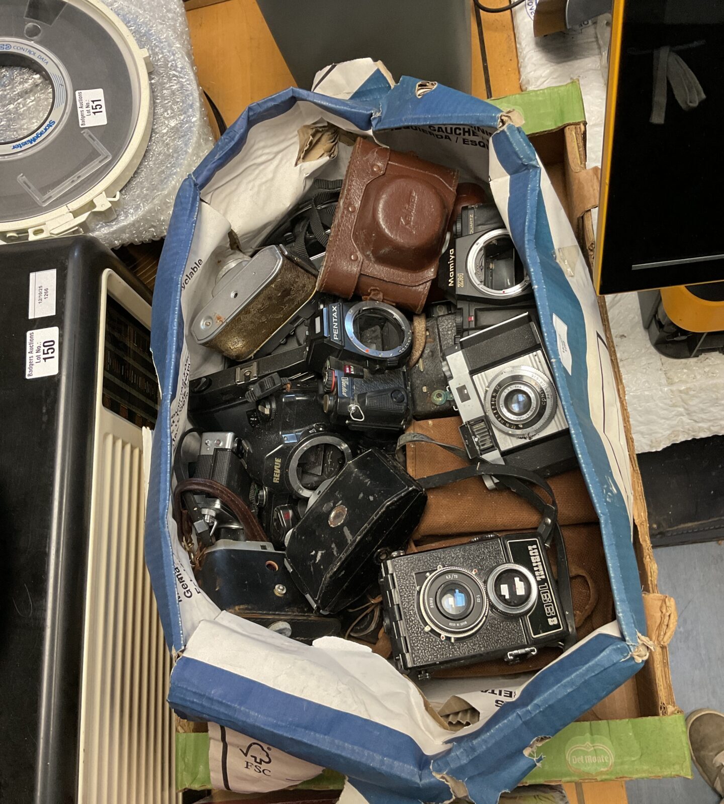 Mixed lot of vintage cameras including Pentax, Lubitel, Revue, and Mamiya.