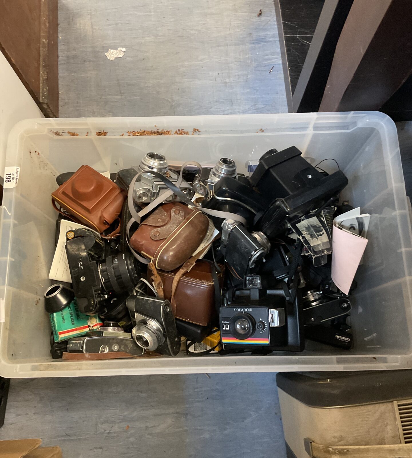 Vintage camera lot including Polaroid, Minolta, and Kodak cameras.