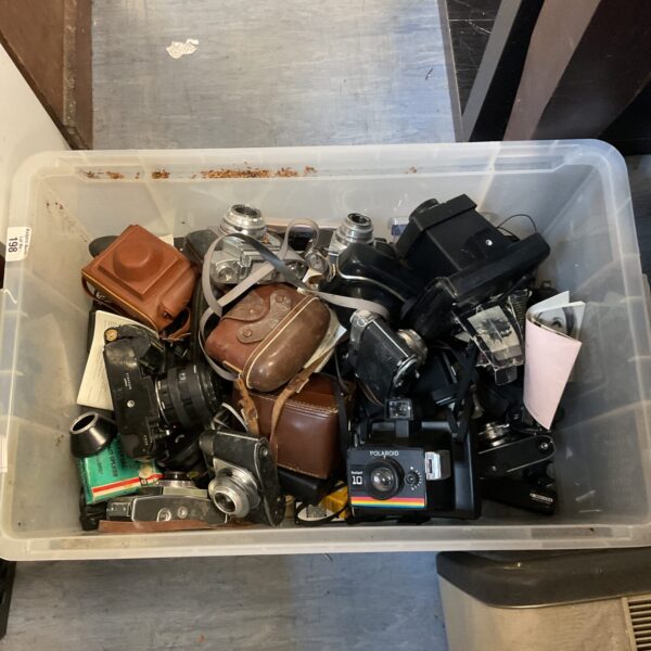 Vintage camera lot including Polaroid, Minolta, and Kodak cameras.
