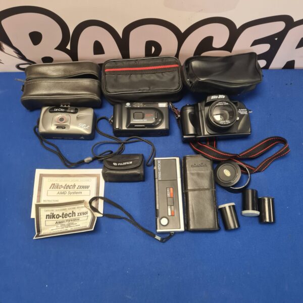 Vintage camera lot featuring a Niko Tech and Minolta film cameras.