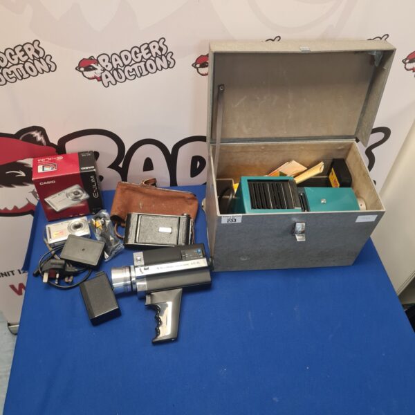Vintage camera lot featuring Canon Exilim and Bells & Howell cameras.