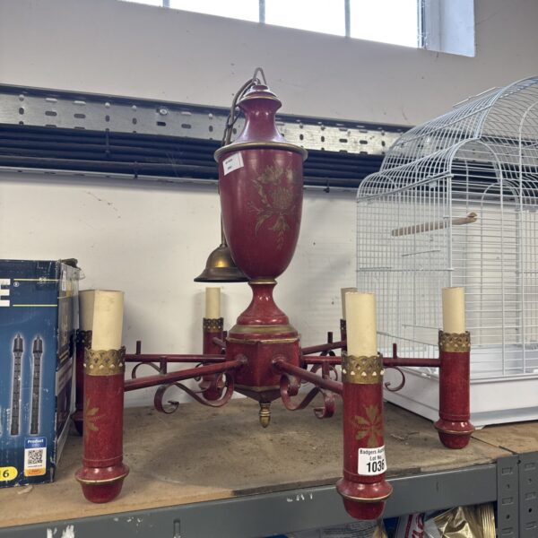 Brass vintage candelabra light fixture with ornate detailing.