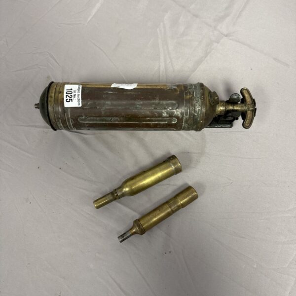 Vintage car fire extinguisher and motorcycle grease guns, automotive collectibles.