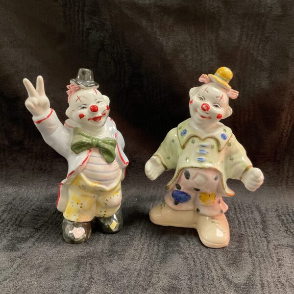 Vintage ceramic clown figurines, detailed and colorful.