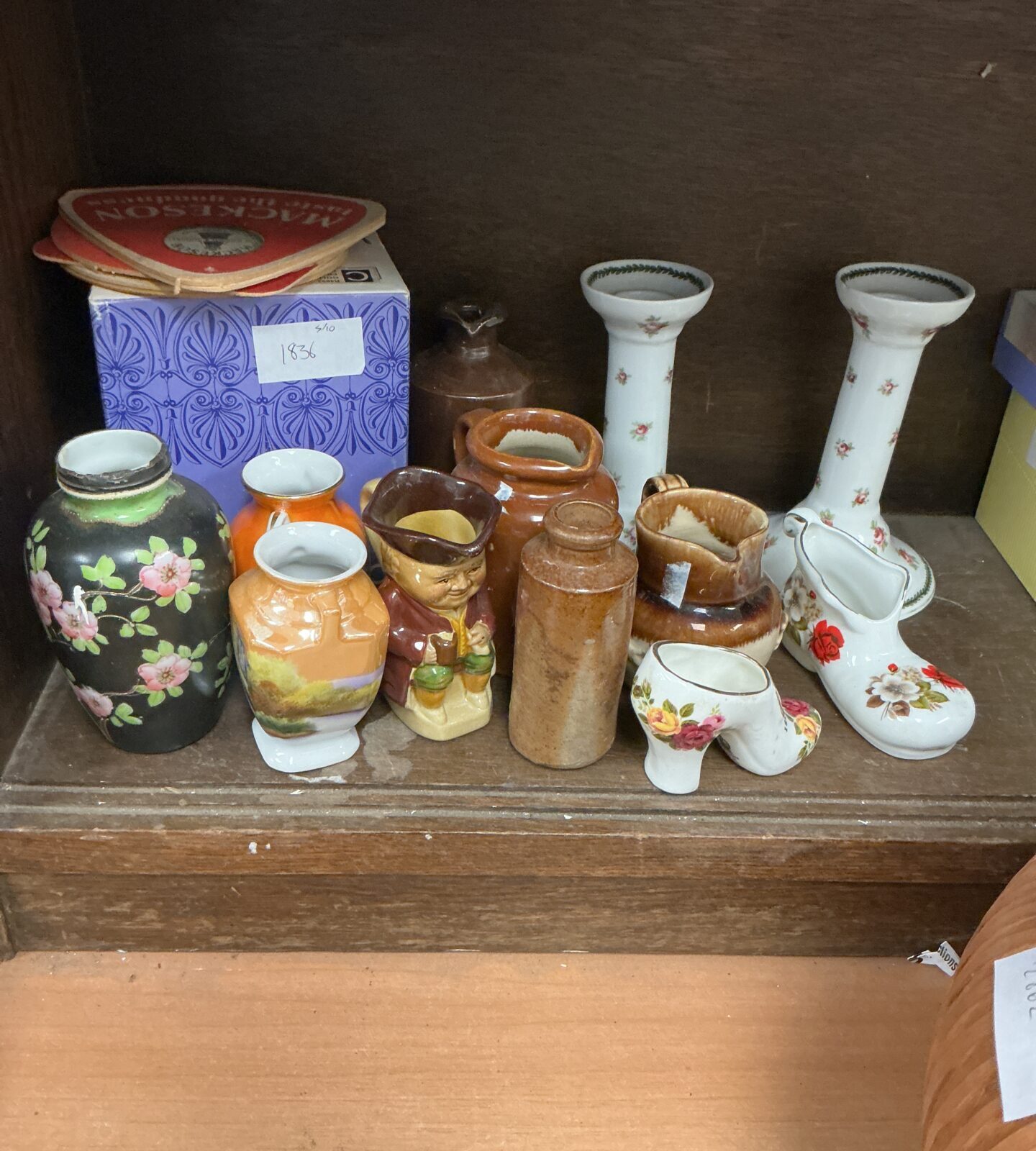 Vintage ceramic figures and small vases in a collectible lot.