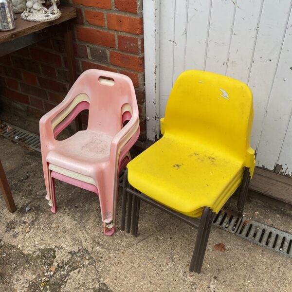 Vintage childrens stacking chairs in bright colours.
