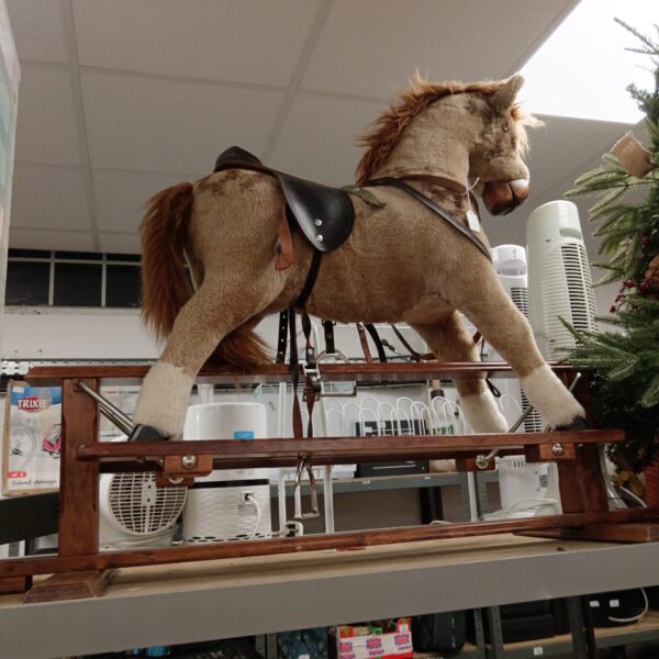 Vintage child's rocking horse on wooden base.
