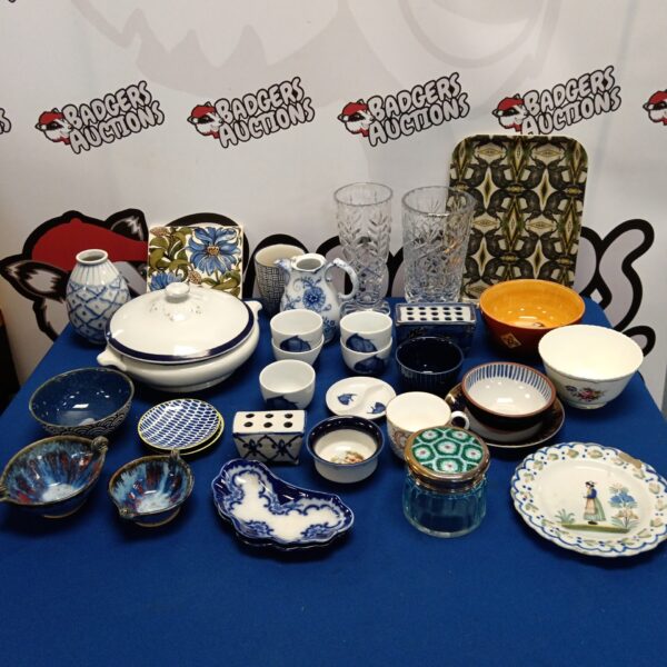 Vintage china and glass collection with bowls, vases, and plates.