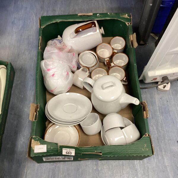 Vintage china tea set with cups, saucers, and two tea pots.