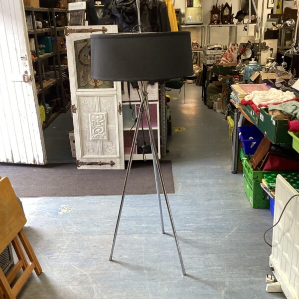 Vintage chrome floor lamp with adjustable head and tripod base.
