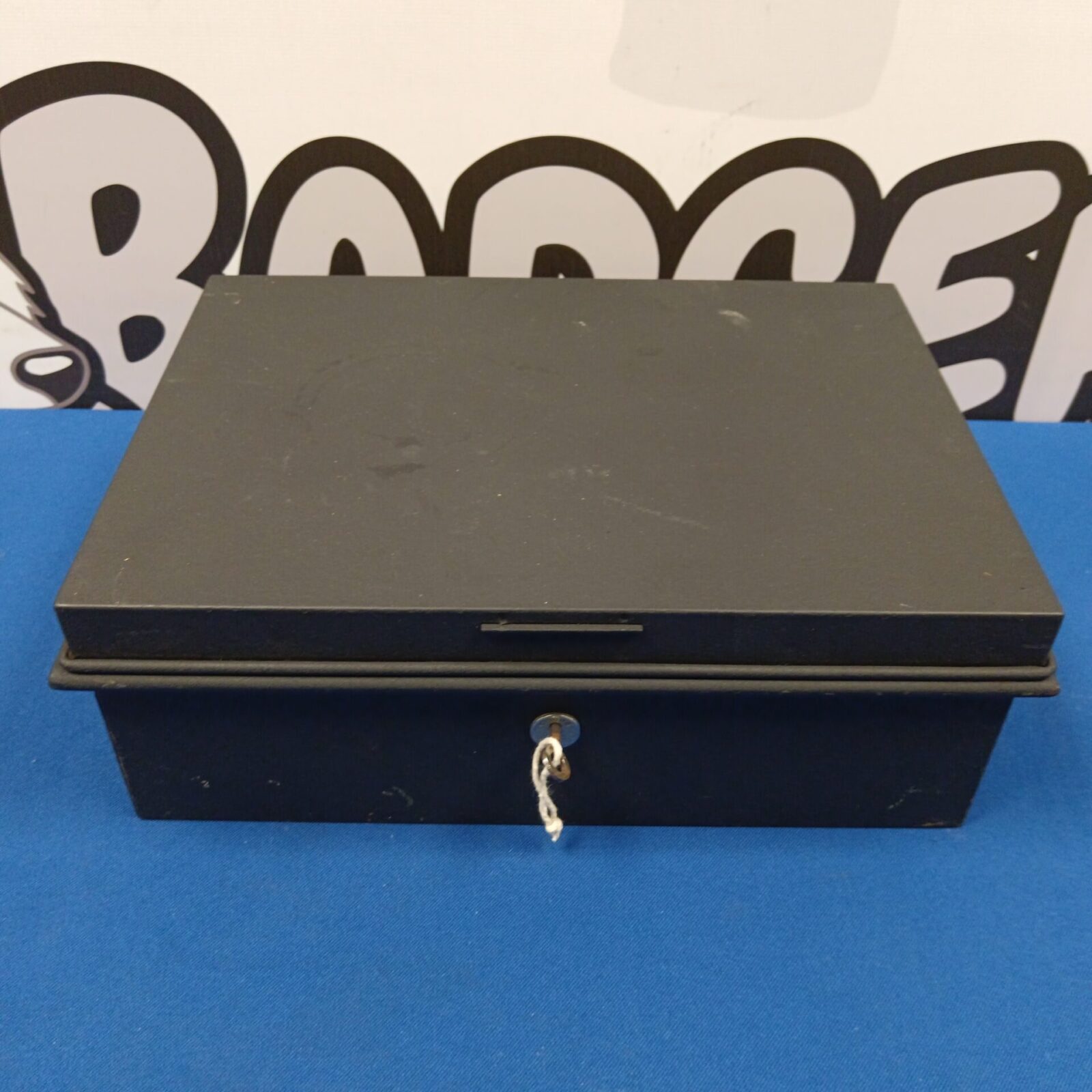 Closed vintage Chubb lock box with key.