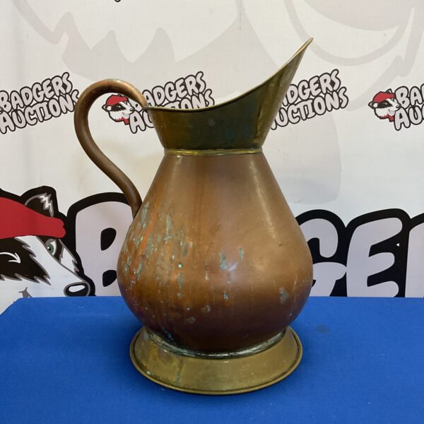Large vintage copper haystack pitcher with brass accents.
