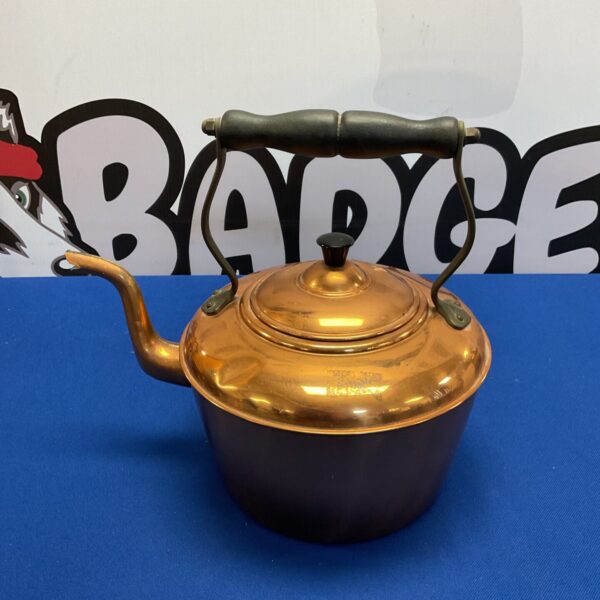 Vintage British copper kettle with a classic design.