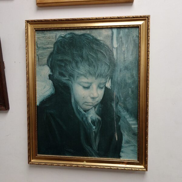 Vintage framed print of a crying child, sentimental Victorian art.