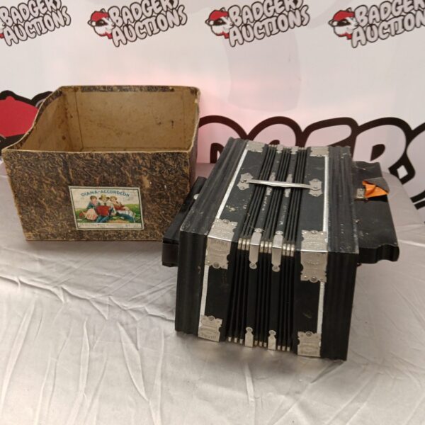 Front view of a vintage Diana button accordion.