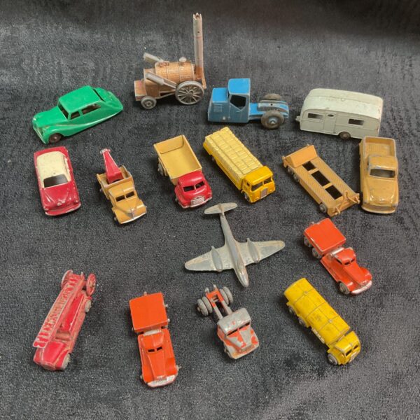 Overview of a vintage diecast vehicle lot with various cars and trucks.