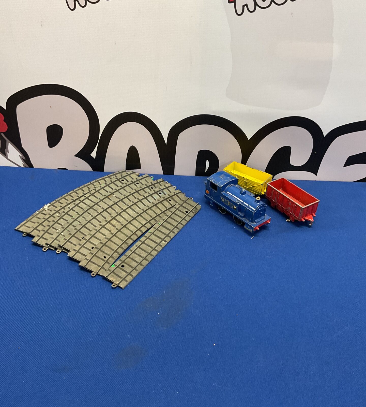 Vintage Dinky train set with tinplate track for collectors.
