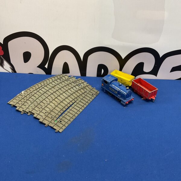 Vintage Dinky train set with tinplate track for collectors.