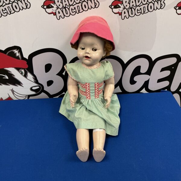 Vintage composition doll in pale green dress.