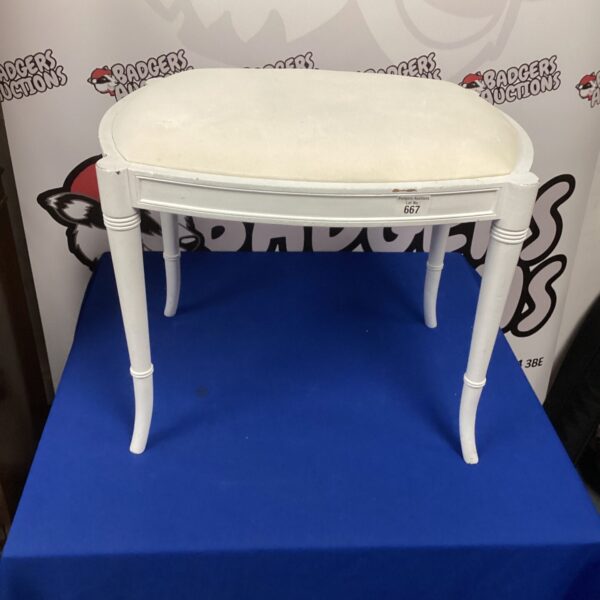 Vintage dressing table stool with upholstered seat and turned legs.