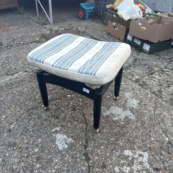 Vintage 1970s E Gomme footstool with patterned fabric.