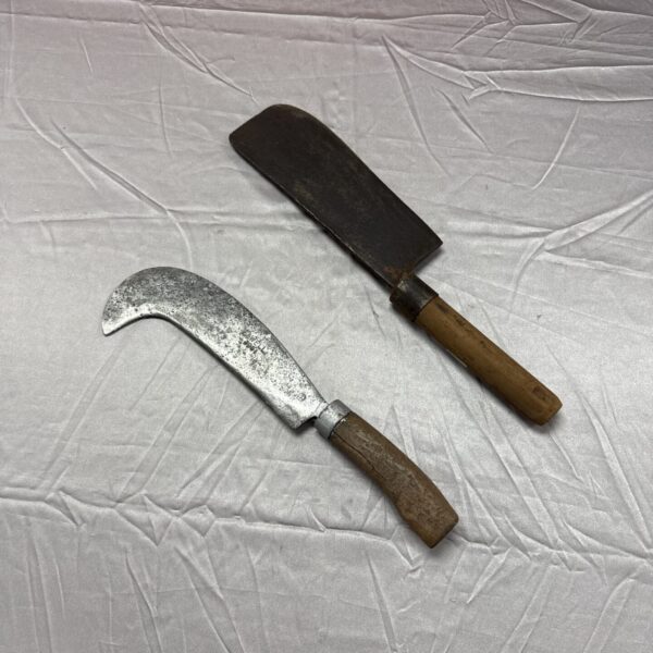 Vintage Elwell billhook with wooden handle and curved blade.