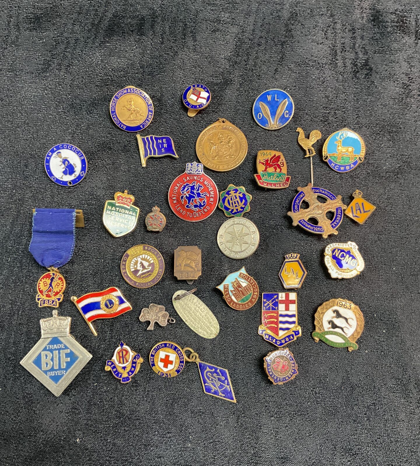 Assorted vintage enamel pin badges, British collectible lapel pins.