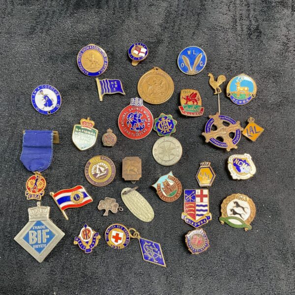 Assorted vintage enamel pin badges, British collectible lapel pins.