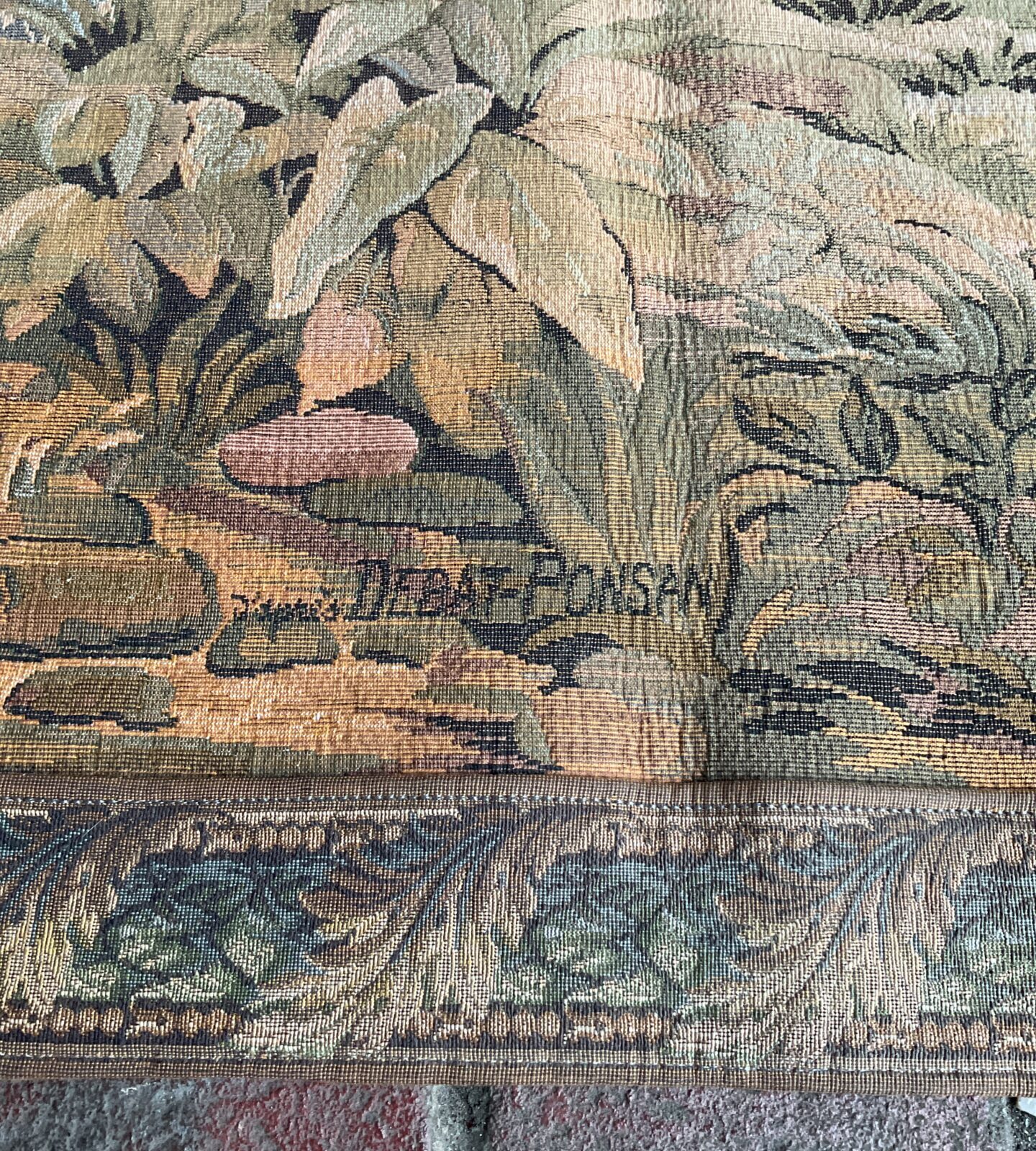 Close-up of vintage Debat Ponsan tapestry showing farm workers.