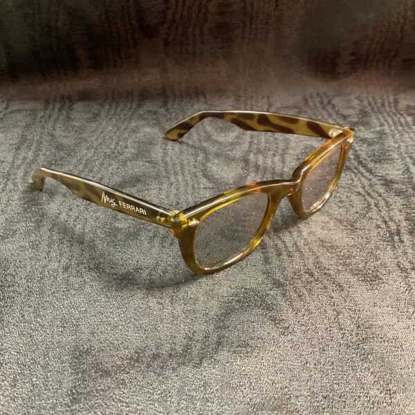 Vintage Ferrari sunglasses with amber tortoiseshell frames.