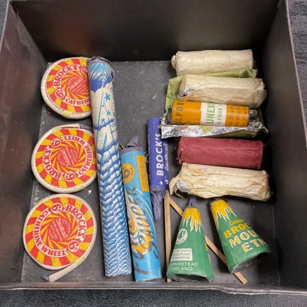 Vintage lot of fireworks and unexposed Ilford film rolls.
