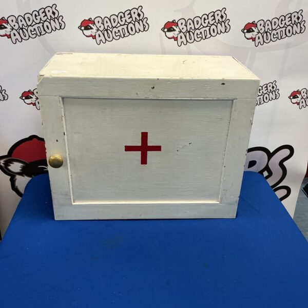 Vintage wooden first aid cabinet with a classic design.